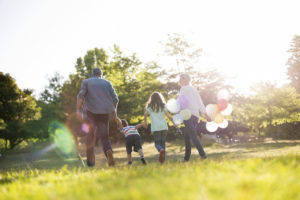 family walking at a plymouth mi park