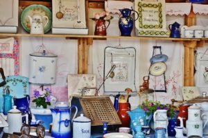 An array of different antiques, including vases, jars, and plates.