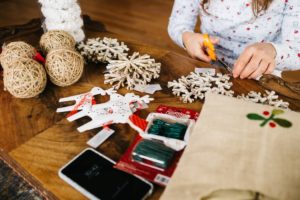 A woman making hand-made Christmas gifts