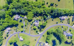 Aerial view of the neighborhood and house