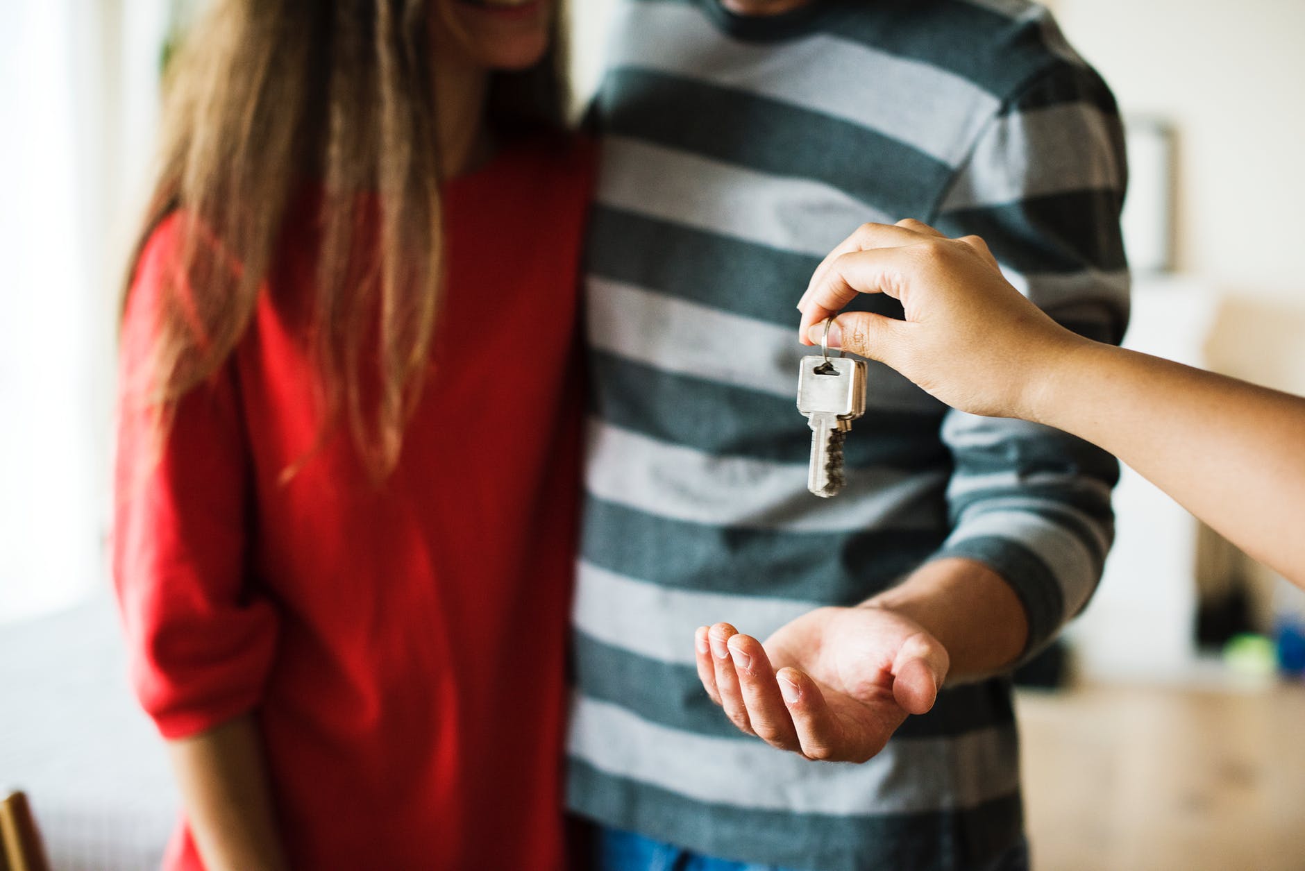 Buyers getting the keys to a house.