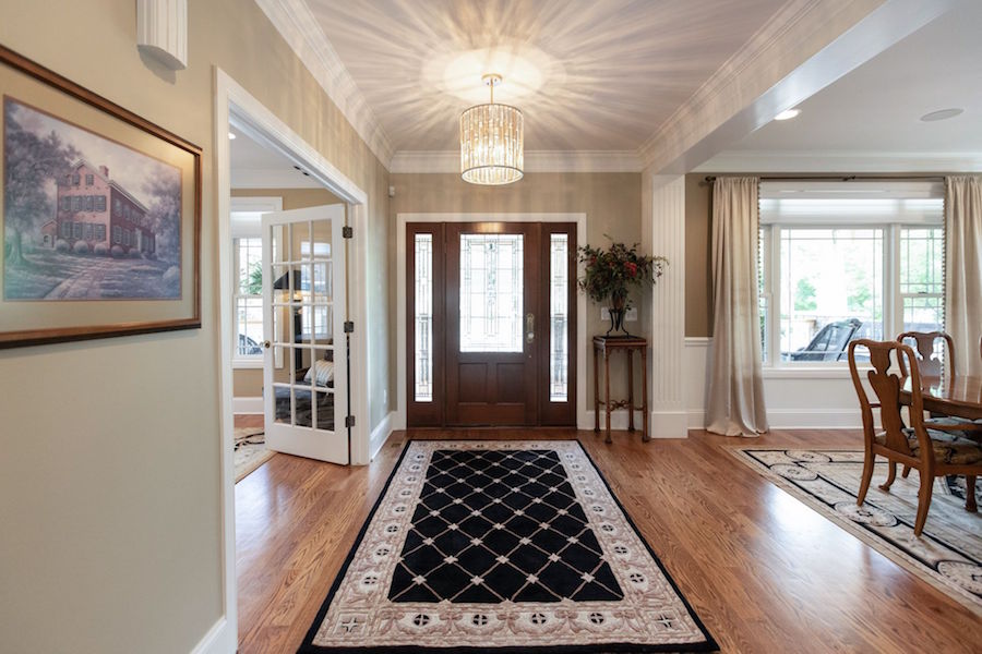 The home's foyer, with access to both the formal dining room and office with bathroom.