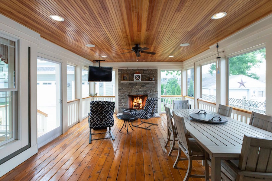 An expansive back porch with fireplace.