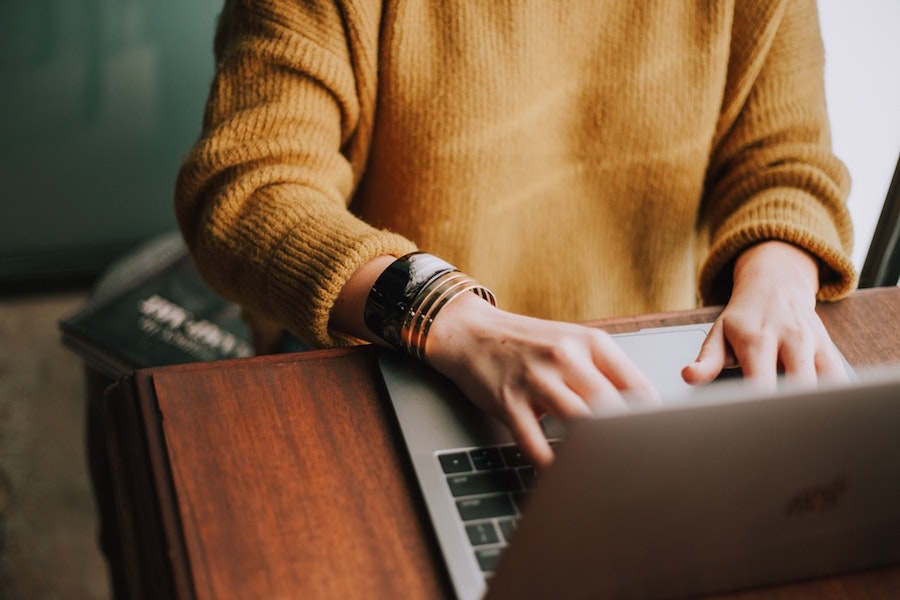 A woman on a laptop.