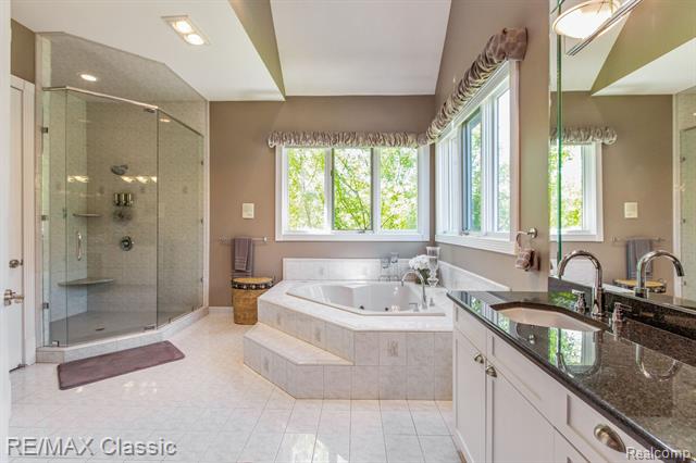 One of the master bathrooms at 13055 Mystic Forest Drive.