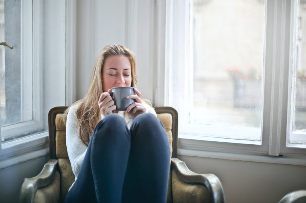 A woman relaxes in her Country Club Village Condo.